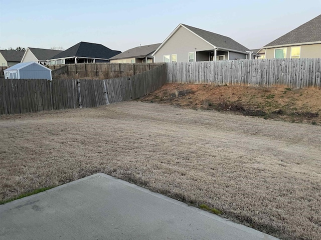 view of yard with a fenced backyard