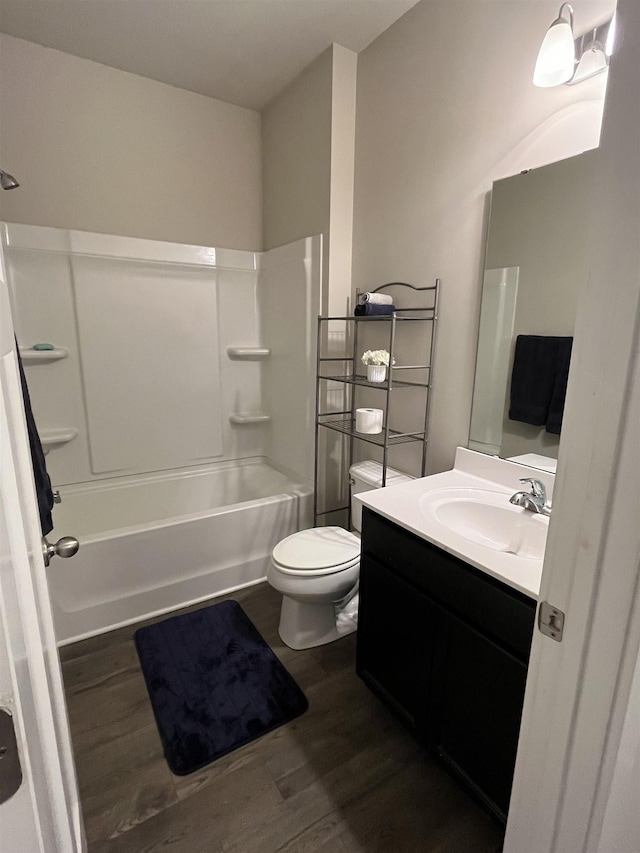 full bathroom with toilet, vanity, bathtub / shower combination, and wood finished floors