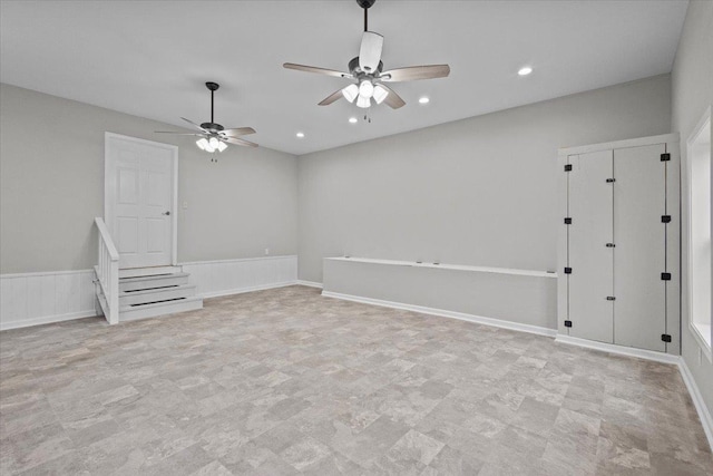 empty room with recessed lighting, baseboards, and a ceiling fan