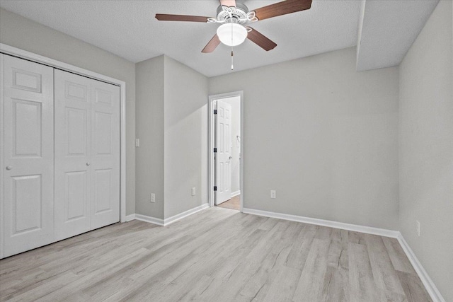 unfurnished bedroom featuring baseboards and wood finished floors