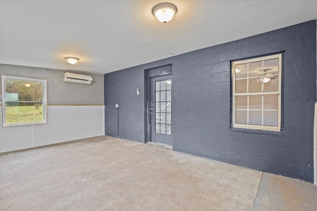 carpeted empty room with a wall mounted AC