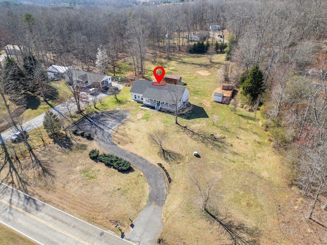 aerial view featuring a wooded view