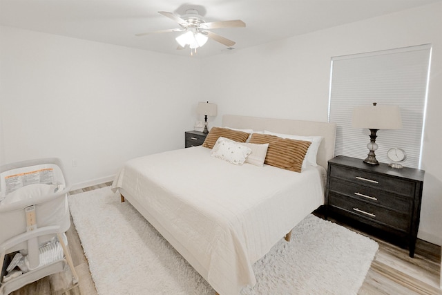 bedroom featuring wood finished floors and a ceiling fan