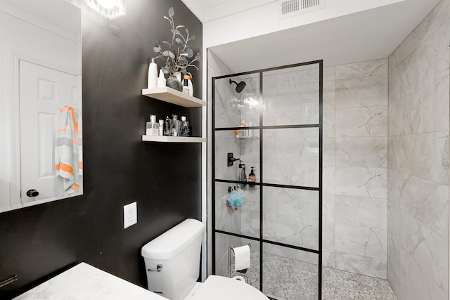 bathroom featuring toilet, visible vents, and walk in shower