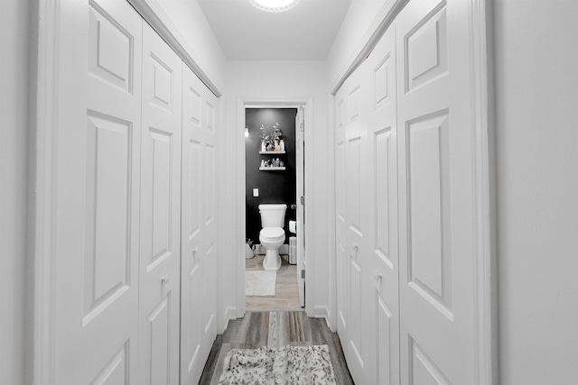 hallway with wood finished floors