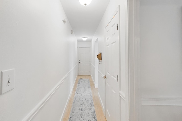 hallway with a decorative wall