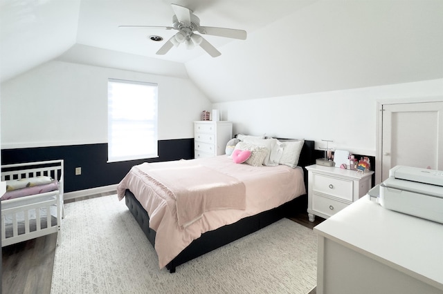 bedroom featuring wood finished floors, ceiling fan, and vaulted ceiling