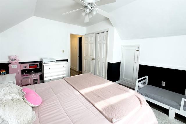 bedroom featuring lofted ceiling, a closet, and ceiling fan