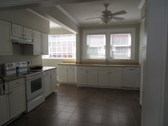 kitchen featuring under cabinet range hood, white appliances, ornamental molding, and white cabinetry