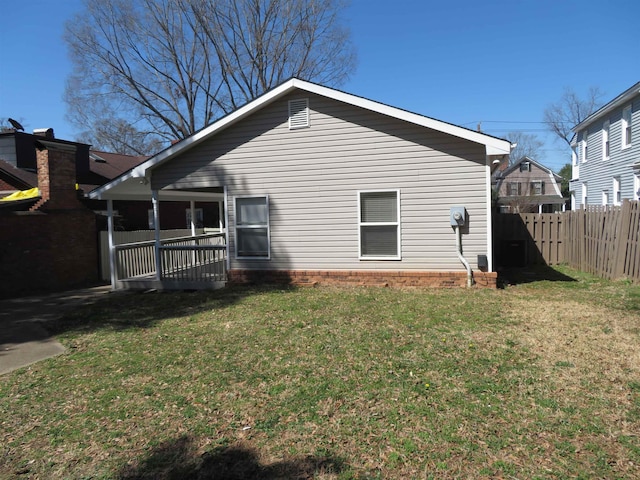 exterior space featuring a yard and fence