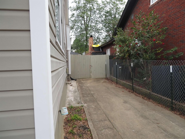 view of side of property with fence