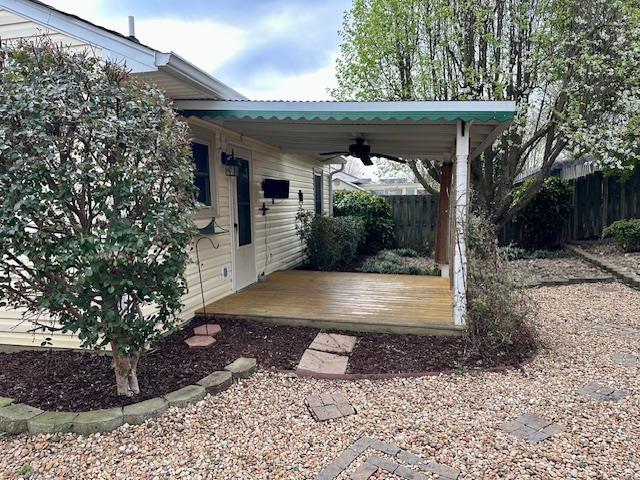 view of patio featuring fence and ceiling fan