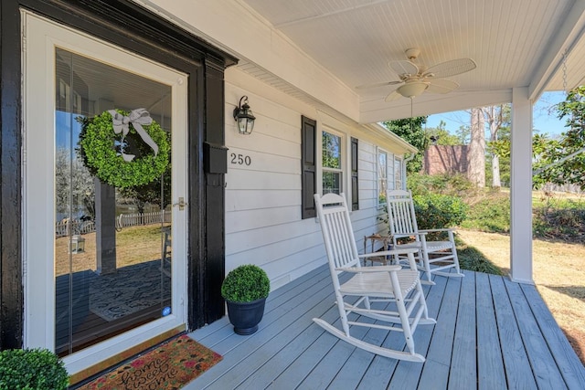 deck with a ceiling fan and covered porch