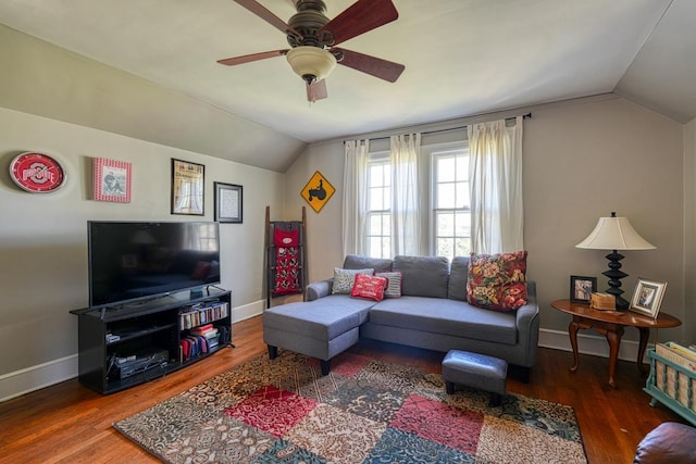 living room with ceiling fan, lofted ceiling, and wood finished floors