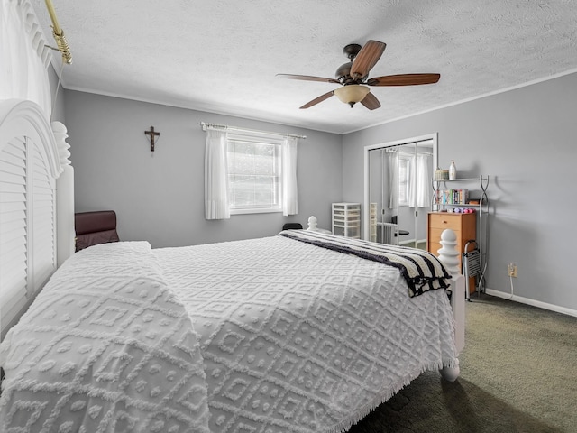 bedroom featuring multiple windows, a ceiling fan, baseboards, and carpet floors