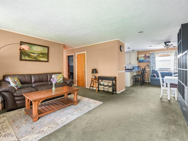 carpeted living area with a textured ceiling and ceiling fan