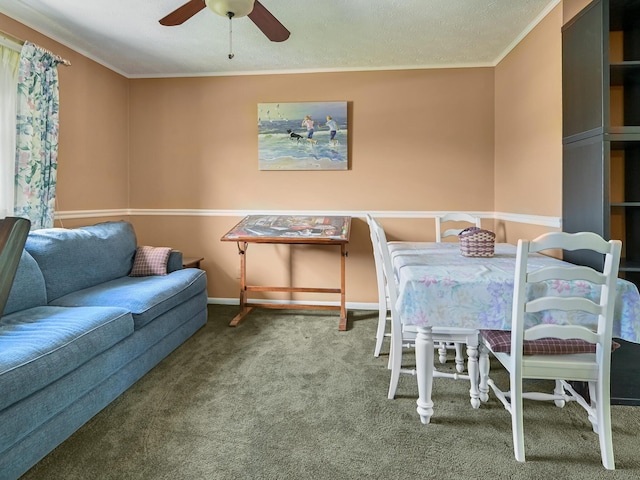 dining area with a ceiling fan, carpet, baseboards, and ornamental molding