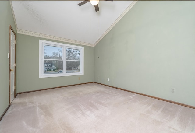 spare room with high vaulted ceiling, baseboards, a ceiling fan, and carpet flooring