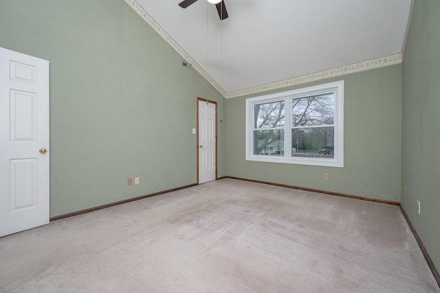 spare room featuring high vaulted ceiling, baseboards, carpet floors, and ceiling fan