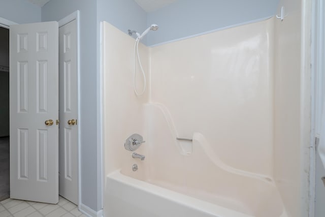 full bath featuring tile patterned floors and shower / bath combination