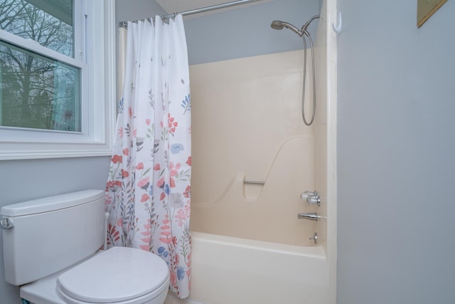 full bath with toilet and shower / tub combo with curtain