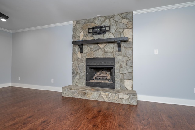 unfurnished living room with a stone fireplace, wood finished floors, baseboards, and ornamental molding