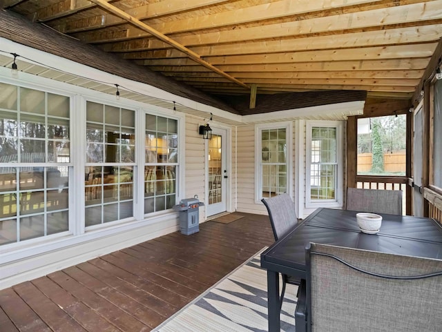 deck with outdoor dining area