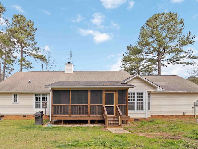 back of property featuring a shingled roof, a chimney, a yard, a sunroom, and crawl space