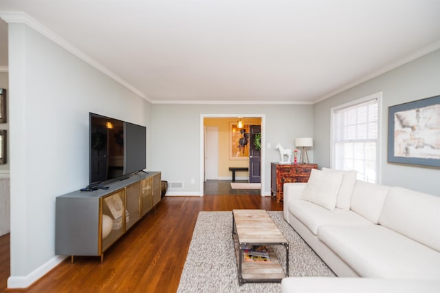 living area featuring visible vents, baseboards, dark wood-style flooring, and ornamental molding