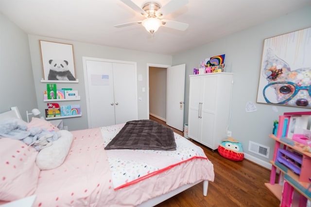 bedroom featuring visible vents, dark wood-type flooring, and a ceiling fan