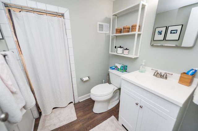 full bath with visible vents, a shower with curtain, toilet, wood finished floors, and vanity