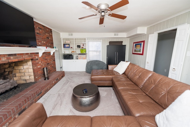 carpeted living area featuring visible vents, a brick fireplace, crown molding, and ceiling fan