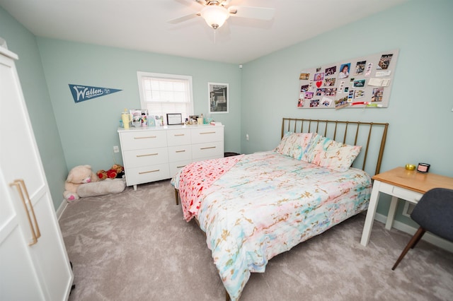 carpeted bedroom featuring a ceiling fan