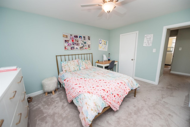 bedroom with baseboards, light colored carpet, and a ceiling fan