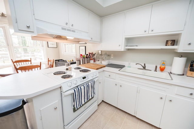 kitchen with a peninsula, open shelves, a sink, under cabinet range hood, and white electric range