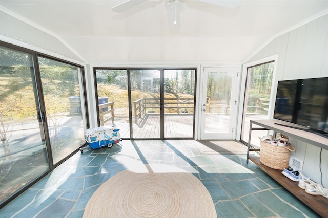 sunroom / solarium with lofted ceiling and ceiling fan