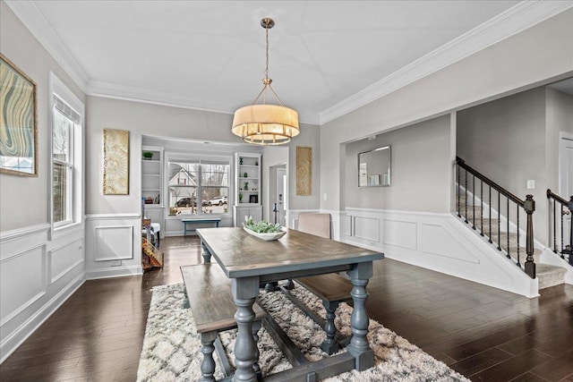 dining space featuring stairway, plenty of natural light, dark wood-style flooring, and built in features