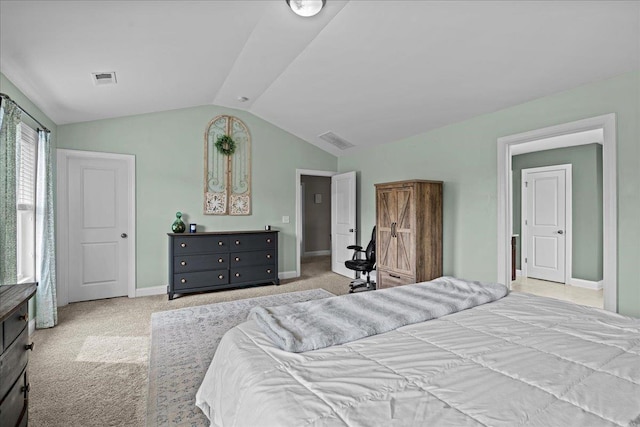 carpeted bedroom featuring visible vents, baseboards, and lofted ceiling