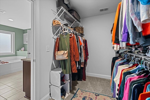 walk in closet with tile patterned flooring and visible vents