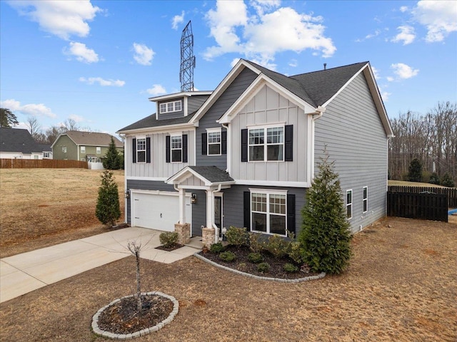 craftsman house with concrete driveway, an attached garage, fence, and board and batten siding