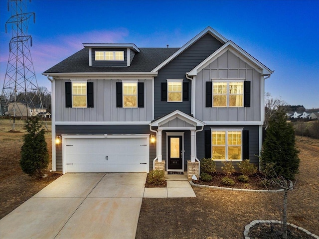 craftsman house featuring board and batten siding, driveway, and a garage