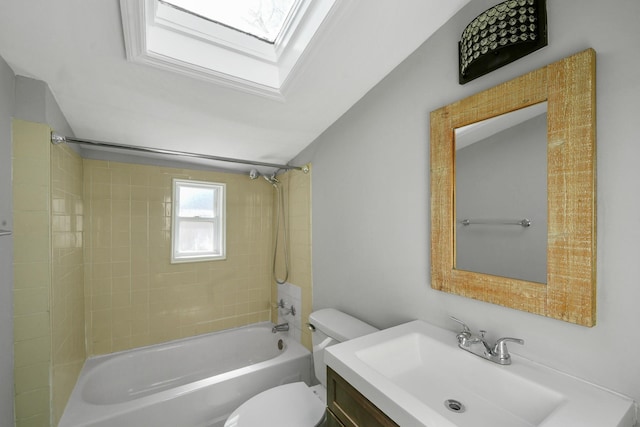 full bathroom featuring vanity, a skylight, toilet, and shower / bath combination