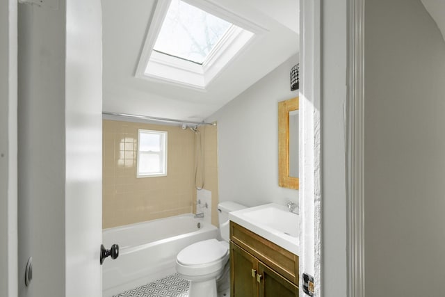 full bathroom featuring toilet, shower / washtub combination, a skylight, and vanity