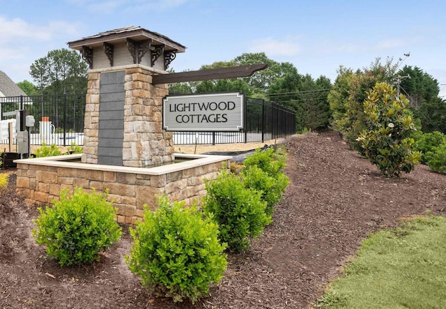 community sign with fence