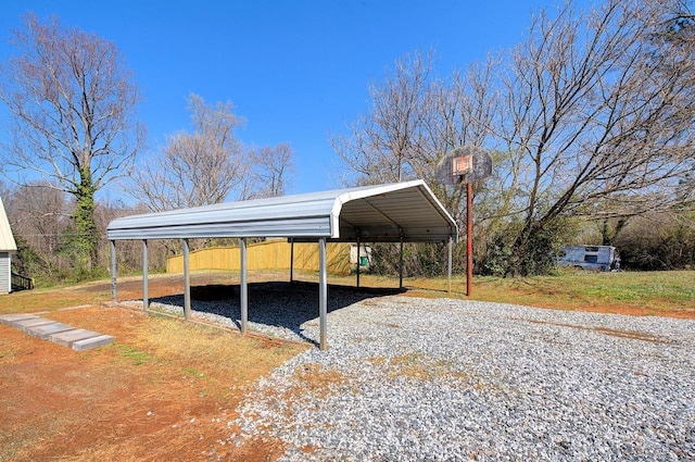 view of vehicle parking with a carport and driveway