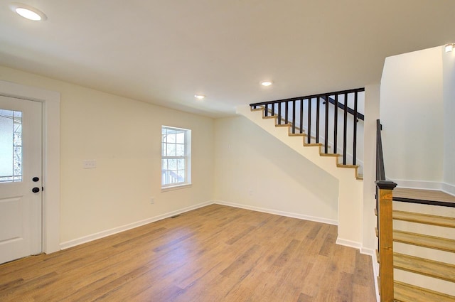 foyer featuring stairway, recessed lighting, light wood-type flooring, and baseboards