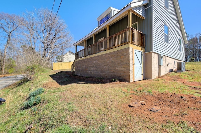 view of property exterior with a lawn