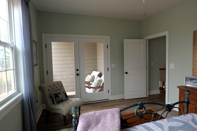 bedroom with french doors, baseboards, a closet, and wood finished floors