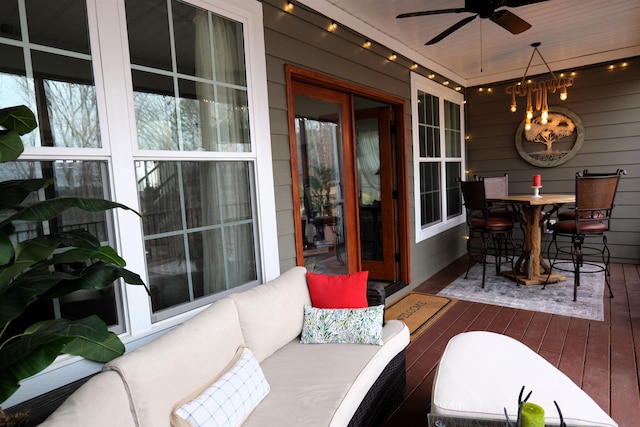 view of patio with a wooden deck, outdoor dining space, outdoor lounge area, and a ceiling fan