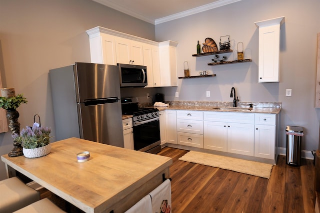 kitchen with dark wood finished floors, open shelves, a sink, stainless steel appliances, and crown molding